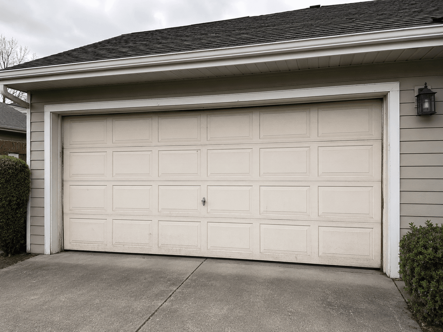 Suburban garage undergoing garage door replacement