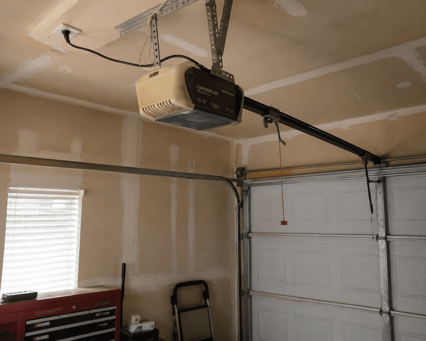 Garage interior with opener and tools