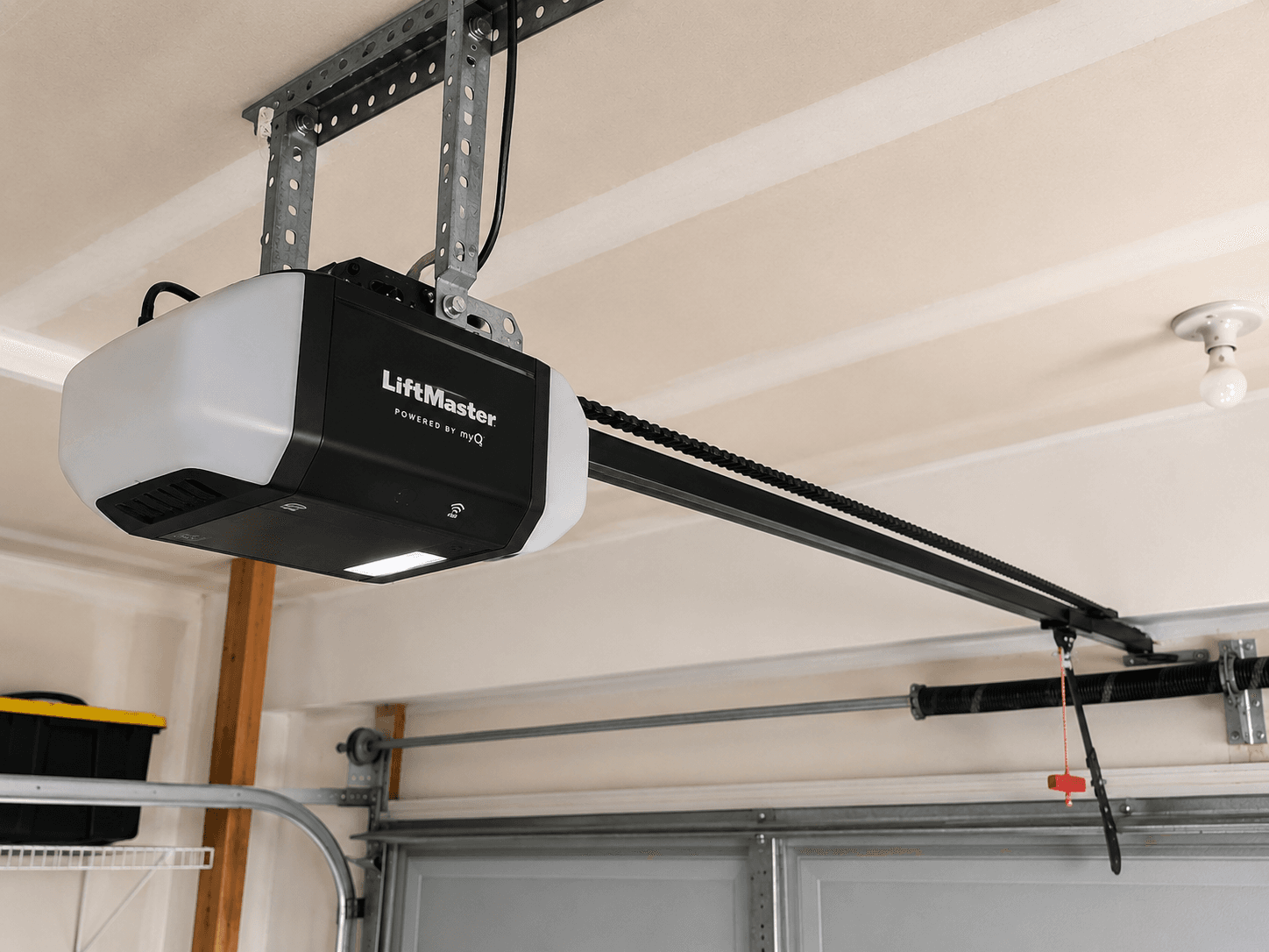 After garage door opener upgrade featuring a modern belt-drive opener installed in a residential garage near Lake Tapps