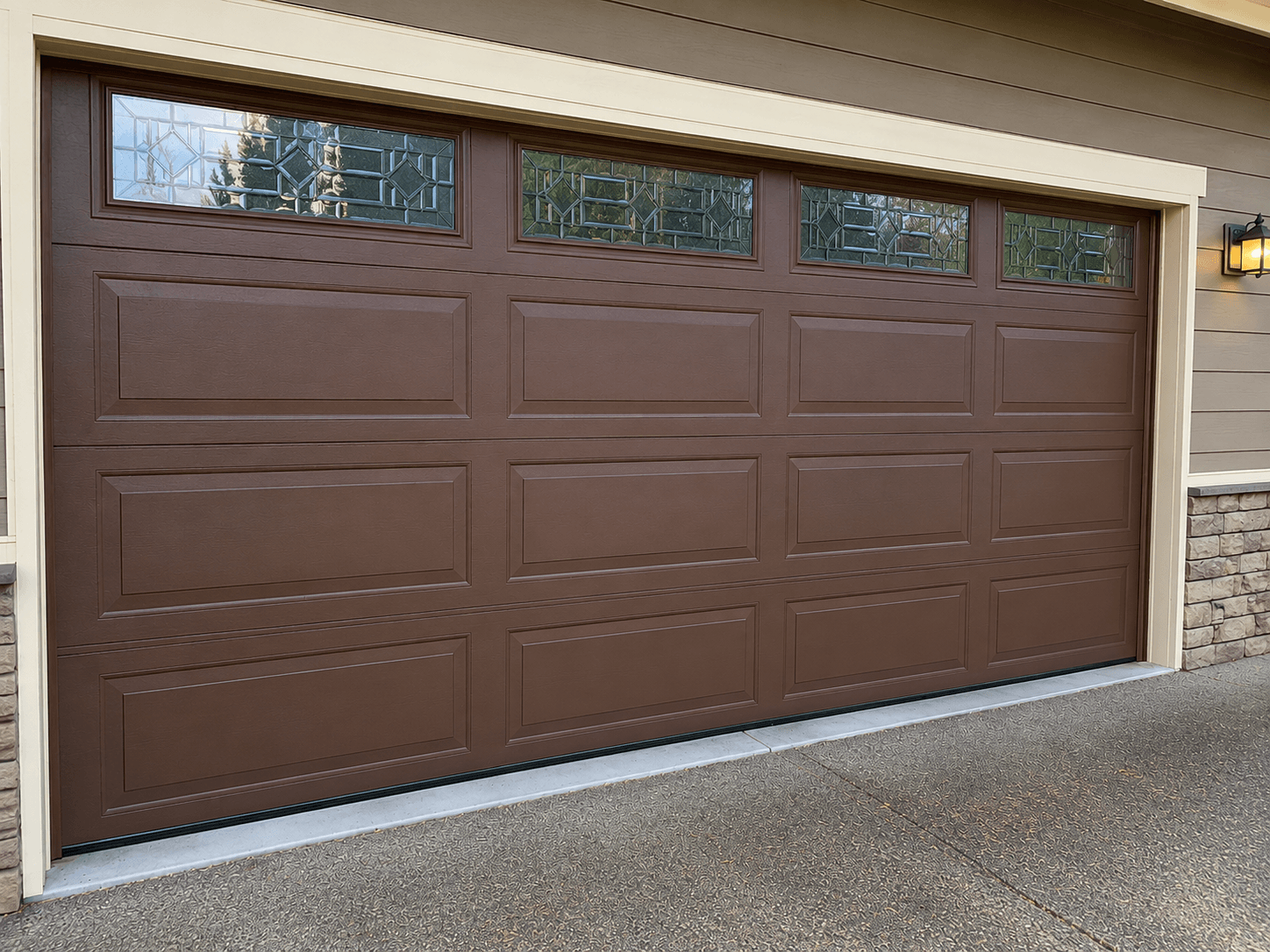 After garage door panel repair showing restored residential garage door panels at a home in East Tacoma