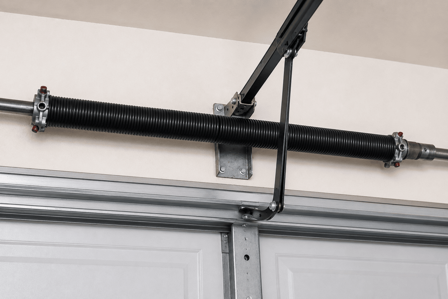 New torsion spring installed during garage door spring replacement, restoring safe, balanced, and reliable door operation